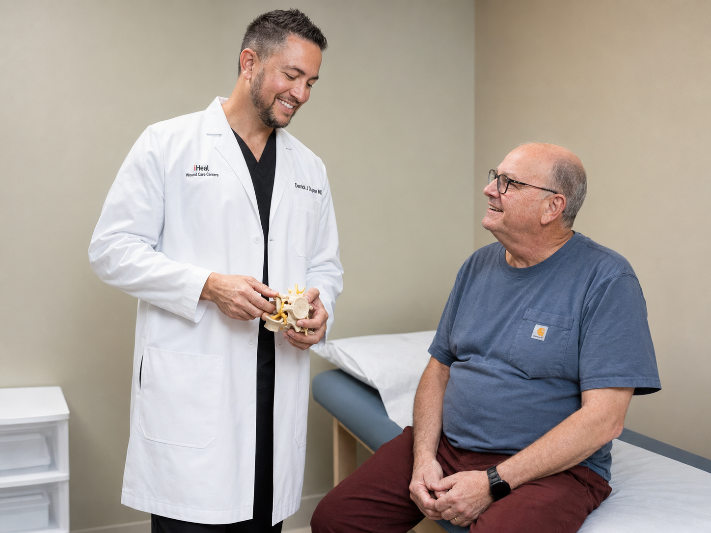 Dr. Dupré speaking with a patient during a wound care consultation